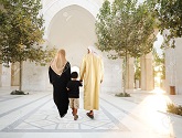8799981-Muslim-arabic-traditional-oriental-family-walking-together-beautiful-ambient-in-front-of-the-mosque-Stock-Photo